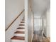 Clean hallway with wood-look floors and staircase at 703 Pine Tree Trl, Atlanta, GA 30349