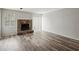 Living room with hardwood floors, fireplace and sliding door at 703 Pine Tree Trl, Atlanta, GA 30349