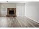 Spacious living room with hardwood floors and fireplace at 703 Pine Tree Trl, Atlanta, GA 30349