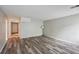 Spacious living area with wood-look floors and hallway access at 703 Pine Tree Trl, Atlanta, GA 30349