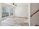 Spacious living room with wood-look floors and large windows at 703 Pine Tree Trl, Atlanta, GA 30349