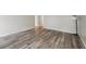 Large living room with wood-look floors at 703 Pine Tree Trl, Atlanta, GA 30349