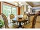 Charming breakfast nook with a round table and chairs, adjacent to the kitchen at 1260 Sweet Woods Dr, Lawrenceville, GA 30044