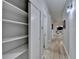 Hallway with built-in shelving and linen closet at 3649 Vanet Rd, Chamblee, GA 30341