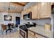 Modern kitchen with stainless steel appliances and wood cabinets at 3649 Vanet Rd, Chamblee, GA 30341