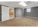 Spacious basement room with gray walls and carpeting at 294 William Bobo Dr, Canton, GA 30115