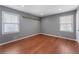 Bright bedroom with hardwood floors and neutral walls at 294 William Bobo Dr, Canton, GA 30115