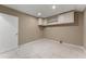 Basement laundry room with white cabinets at 294 William Bobo Dr, Canton, GA 30115