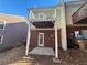 Brick townhouse with a deck and small patio at 3230 Mill Springs Cir, Buford, GA 30519