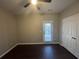 Spacious bedroom with dark hardwood floors and private access to patio at 3230 Mill Springs Cir, Buford, GA 30519