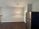 Dining area with hardwood floors and modern light fixture at 3230 Mill Springs Cir, Buford, GA 30519