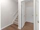 Entryway with stairs, hardwood floors and storage at 3230 Mill Springs Cir, Buford, GA 30519