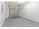Attached garage with grey flooring and storage at 3230 Mill Springs Cir, Buford, GA 30519