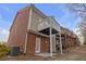Brick townhouse with elevated deck and patio at 3230 Mill Springs Cir, Buford, GA 30519