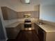 Modern kitchen with granite countertops and stainless steel appliances at 3230 Mill Springs Cir, Buford, GA 30519