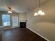 Living room with fireplace, dark hardwood floors, and patio access at 3230 Mill Springs Cir, Buford, GA 30519