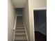 Stairwell leading to upper level, neutral wall colors, carpeted stairs at 3230 Mill Springs Cir, Buford, GA 30519