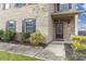 Front entry of brick home with landscaping and walkway at 617 Ocean Ave, Canton, GA 30114