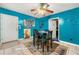 Bright dining area with teal walls, table, and chairs at 120 Aspen Forest Dr, Covington, GA 30016