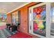 Inviting front porch with red floor and two wicker chairs at 120 Aspen Forest Dr, Covington, GA 30016