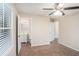 Bright bedroom with ceiling fan and ensuite bathroom access at 245 Bromack Se Dr, Atlanta, GA 30315