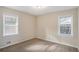 Bedroom with two windows and neutral decor at 245 Bromack Se Dr, Atlanta, GA 30315