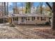 Brick ranch house with a landscaped yard and driveway at 245 Bromack Se Dr, Atlanta, GA 30315