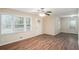 Living room with hardwood floors, large windows and ceiling fan at 245 Bromack Se Dr, Atlanta, GA 30315