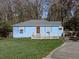Charming blue house with a white deck and landscaped lawn at 2538 Gordon Se Cir, Smyrna, GA 30080