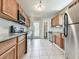 Modern kitchen with stainless steel appliances and wood cabinets at 2538 Gordon Se Cir, Smyrna, GA 30080