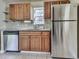 Kitchen with stainless steel appliances and wood cabinets at 2538 Gordon Se Cir, Smyrna, GA 30080
