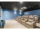 Theater room with brown reclining chairs and a large screen at 3481 Lakeside Ne Dr # 1406, Atlanta, GA 30326