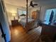 Main bedroom with king-size bed and hardwood floors at 2566 N Hightower Trl, Conyers, GA 30012