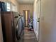 Convenient laundry room with washer, dryer, and extra storage at 2566 N Hightower Trl, Conyers, GA 30012