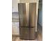 Stainless steel refrigerator in the updated kitchen at 3061 Brooks Dr, Snellville, GA 30078