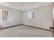 Spacious bedroom with carpeted floors and large window at 7546 Palmetto Way, Riverdale, GA 30274