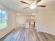 Open living room with kitchen island, and L-shaped sectional sofa at 558 Fairview Oak Pl, Dallas, GA 30157