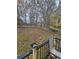 Fenced backyard with mature trees and a deck at 435 Amy Blvd, Temple, GA 30179