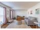 Spacious living room featuring hardwood floors and ample natural light at 1721 Berry Ln, Snellville, GA 30078