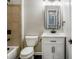 Bathroom with white vanity, tiled shower, and modern fixtures at 608 Chickory Ct, Woodstock, GA 30188