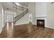 Living room with fireplace, staircase, and hardwood floors at 608 Chickory Ct, Woodstock, GA 30188