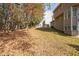 Landscaped backyard with mature trees at 642 Towering Pine Trl, Lawrenceville, GA 30045