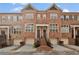 Charming brick townhome with two-car garage and inviting front entrance at 1690 Mosaic Way, Smyrna, GA 30080