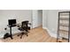 Well-lit home office with an adjustable standing desk and a shelving unit at 1690 Mosaic Way, Smyrna, GA 30080