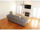 Living room with hardwood floors, fireplace, and french doors to balcony at 1690 Mosaic Way, Smyrna, GA 30080