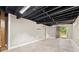 Unfinished basement with concrete floors and exterior access at 3263 Dodson Dr, Atlanta, GA 30344