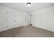 Simple bedroom with carpet and access to hallway at 237 Harmony Woods Dr, Dallas, GA 30157