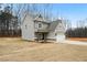 Two-story house with gray siding, a white garage door, and a landscaped yard at 237 Harmony Woods Dr, Dallas, GA 30157