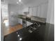 Modern kitchen with granite countertops and stainless steel appliances at 3108 Garrard Pl, Atlanta, GA 30360