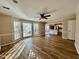 Spacious living room with hardwood floors and views into kitchen area at 3210 Woolbridge Ln, Marietta, GA 30062